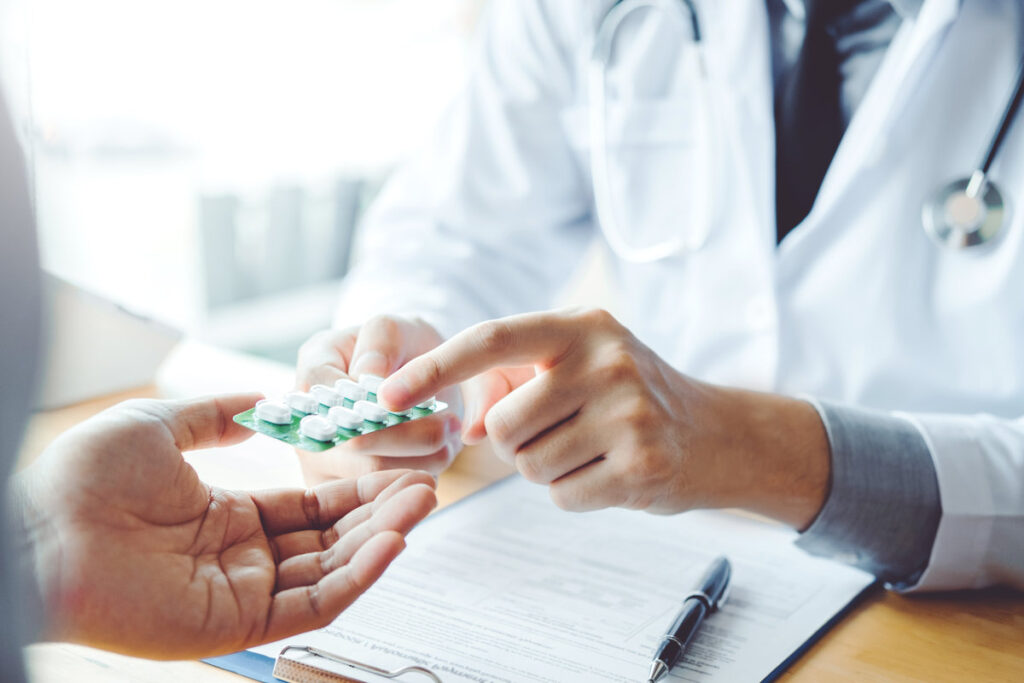 Doctor or physician recommend pills medical prescription to male